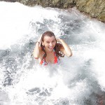 Splash! A wave breaks into a tidepool, scaring Yasmin.