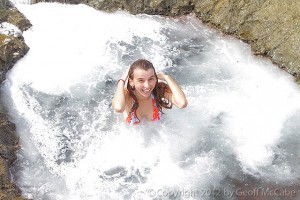 Splash!  A wave breaks into a tidepool, scaring Yasmin.